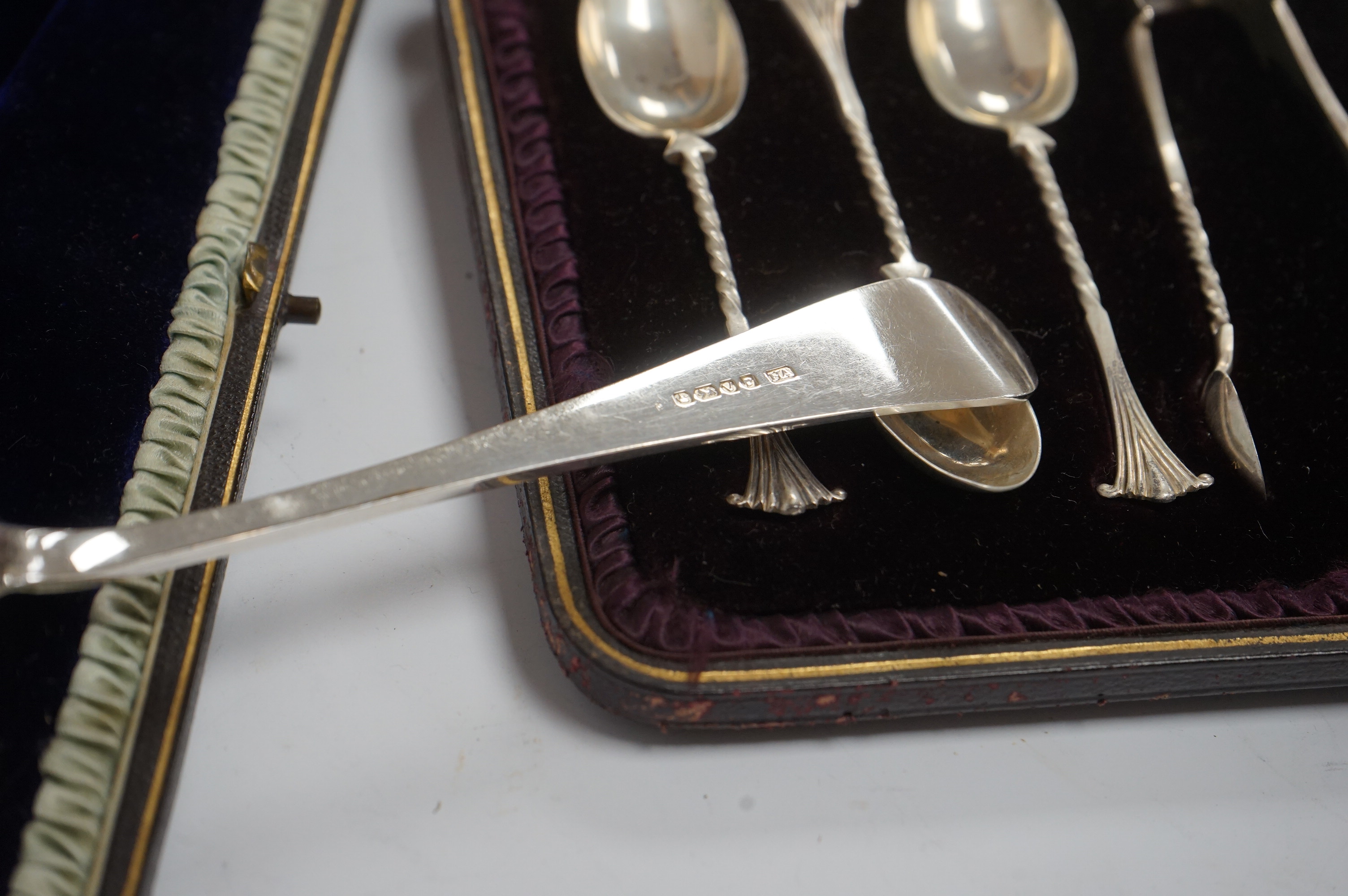 A cased pair of Victorian silver serving spoons and matching sifter spoon with engraved floral decoration, Atkin Brothers, Sheffield, 1888, together with a cased set of six late Victorian silver coffee spoons and matchin